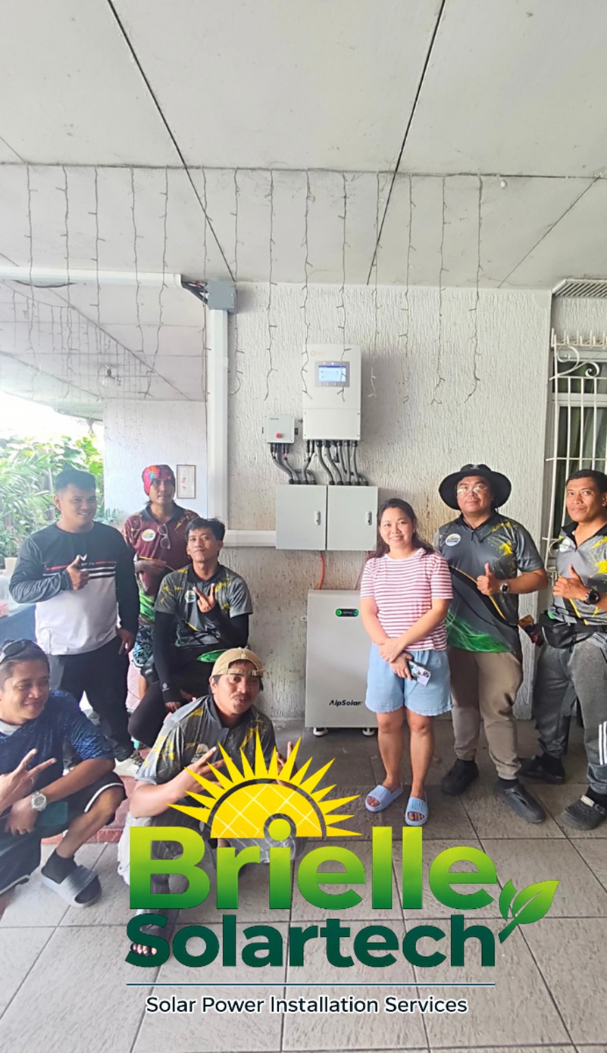Customers and installers beside mounted solar equipment